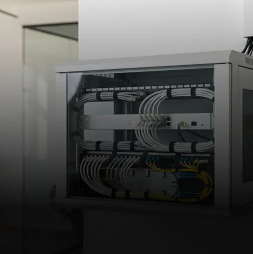 Network on site support: neatly organized server rack with cables.