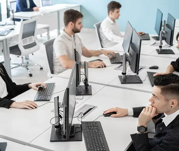 IT support team working on computers, providing network on-site support.