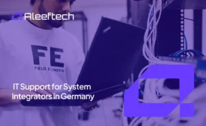 IT support technician working on a laptop in a server room in Germany