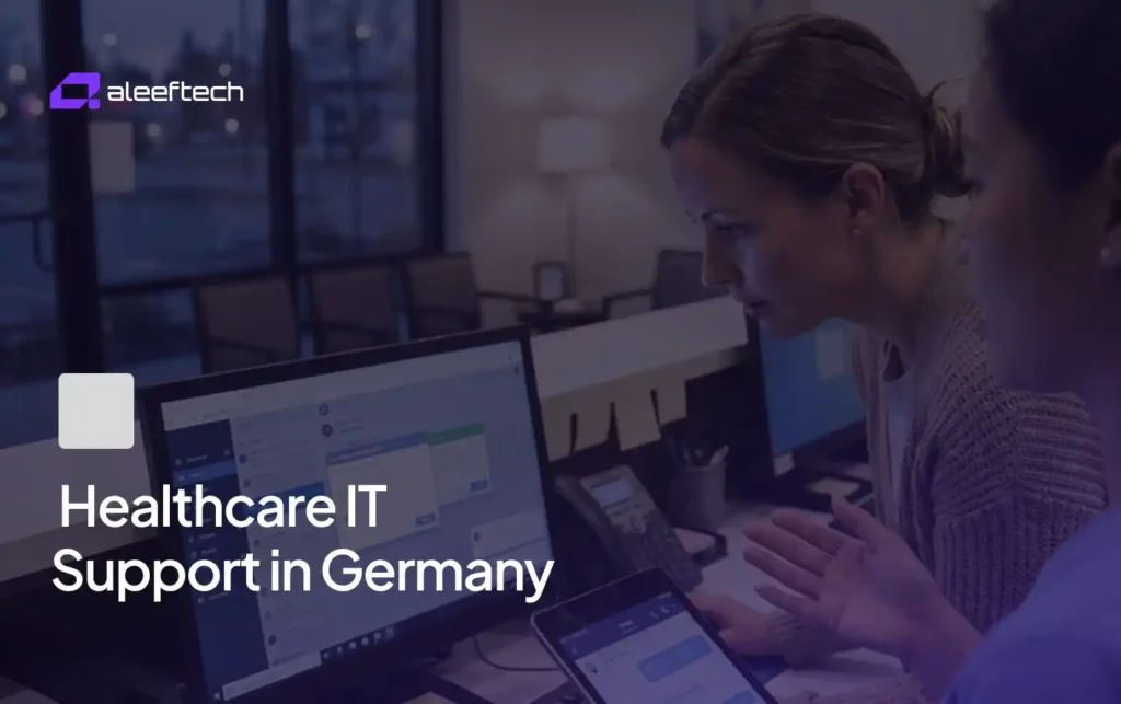 Healthcare IT support in Germany: Two women review data on computer screens.